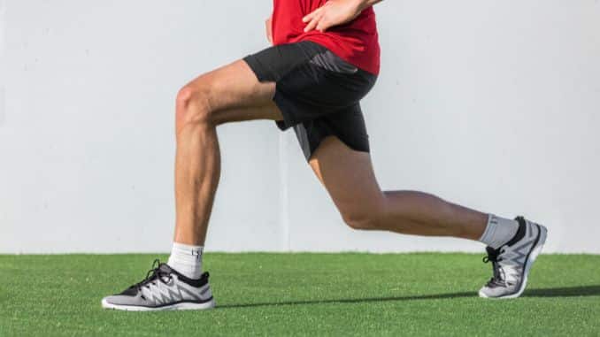 fitness man doing leg workout - keystone deadlift