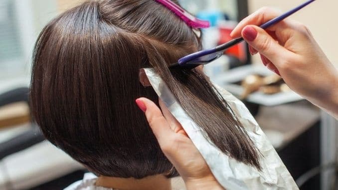 Hairdresser-Paints-hair - causes of hair loss