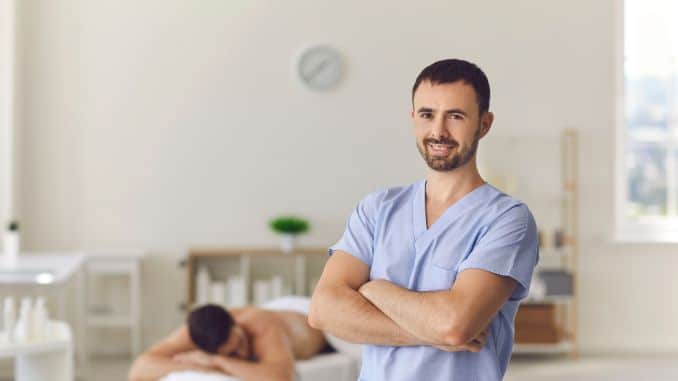 therapist-standing-arms-crossed - De quervain's Tenosynovitis Massage