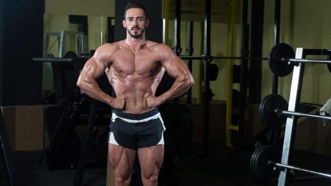 man-strong-flexing-muscles - how many exercises per workout