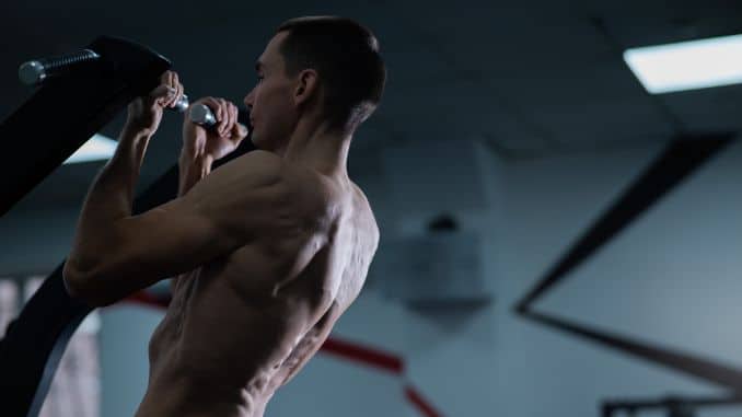 shirtless-man-pull-ups-gym