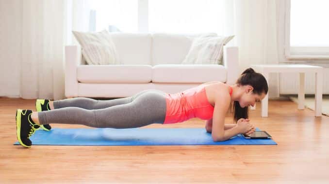 teenage-girl-doing-plank-home - proper arm position for front plank
