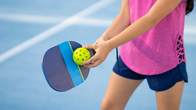 girl-practicing-a-pickle-ball-server